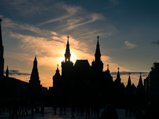 State Historical Museum at Red Square in Moscow, Russia. Sunset sun peaking through historic tower silhouette.