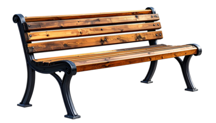 Wooden park bench with ornate black metal legs against a black backdrop