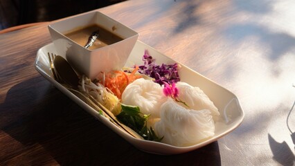 Rice noodles with fish curry sauce .It is Thai food 