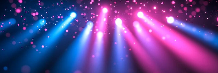 Obraz premium A vibrant stage with dynamic lighting effects. Abstract glowing lights in blue and pink hues create a lively, energetic atmosphere.