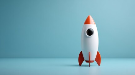 Colorful retro rocket model standing on a blue background, symbolizing innovation, exploration, and dreams of space travel for projects and designs
