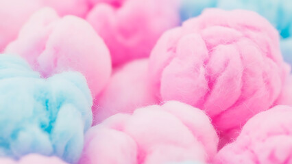 Fototapeta premium Close-up of fluffy pink and blue cotton candy, a sweet and airy confection delight