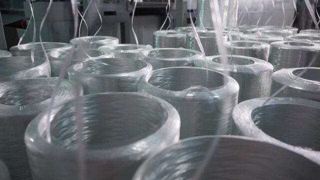 Coiled Fiberglass Roving Is Systematically Arranged On Pallets With Clear Labels And Lighting Effects