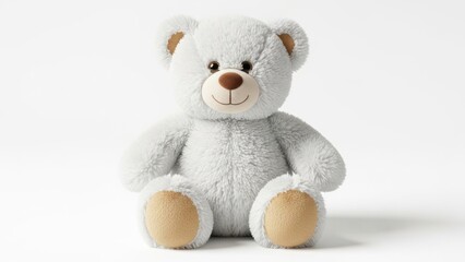 Fototapeta premium Fluffy white teddy bear sitting on a white background with soft light