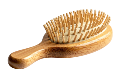 Close-up of a wooden hairbrush with wooden bristles on black