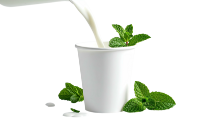 Stream of liquid fills a paper cup, mint leaves arranged around