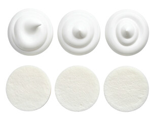 Six white circles of textured cream atop of light-colored cotton pads