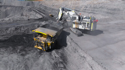 Extraction and loading process of coal-type minerals for energy production in a power plant