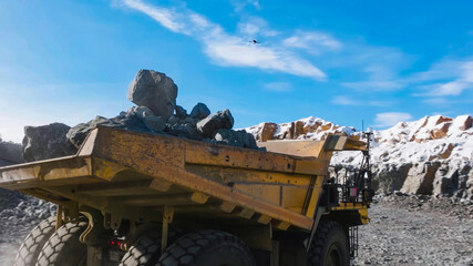 Mining dump truck in the process of loading and transporting rock to spoil heaps © WILL PHOTOGRAPHY