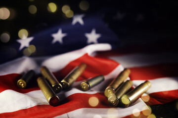 Award to the allies in the second world war.Many bullets cartridges and medals on United States flag. Concept of war glory victory.