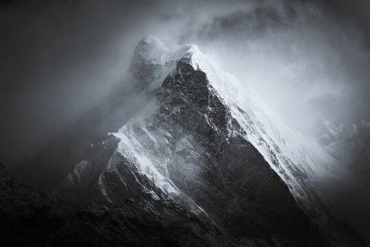 Dramatic Black and White Mountain Peak in Storm Clouds