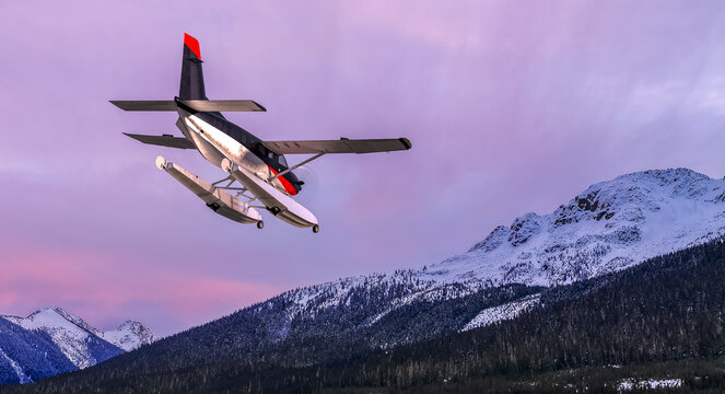 Dramatic Purple Sky Over Snowy Mountains As Bush Plane Lifts Off In BC