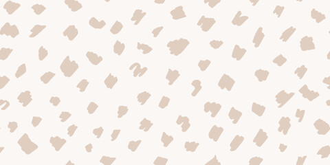Deer skin seamless pattern in neutral beige colors. Hand-drawn spotted texture in light cream tones, organic abstract background. Fawn-inspired polka dots for cute baby design and traditional decor © babayuka