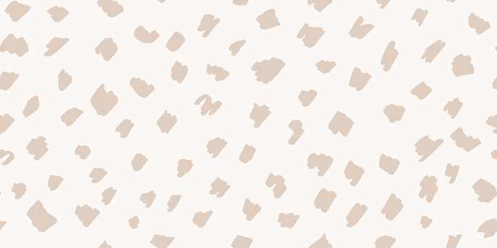 Deer skin seamless pattern in neutral beige colors. Hand-drawn spotted texture in light cream tones, organic abstract background. Fawn-inspired polka dots for cute baby design and traditional decor