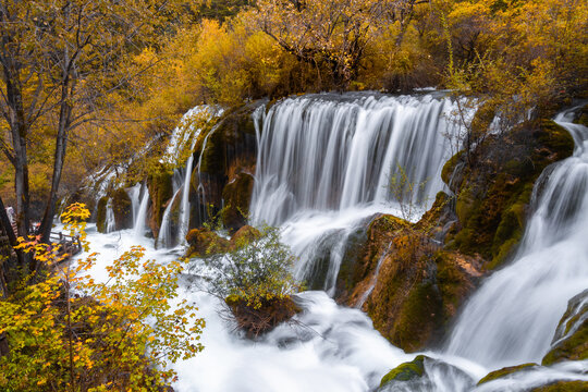 Shuzheng Waterfall is a beautiful and prominent waterfall in Jiuzhaigou National Park, Sichuan Province, China. It is approximately 25 meters high and 62 meters wide