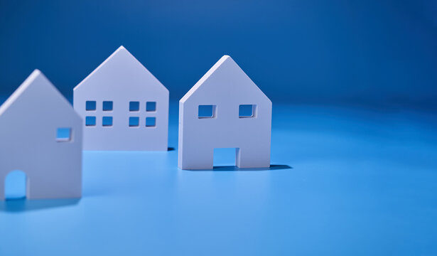 2d white house model against blue background