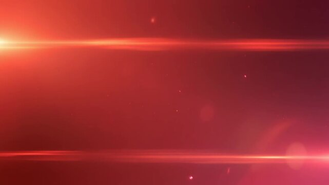 Abstract red background with glowing light flares and subtle particles creating a dynamic and energetic visual effect.