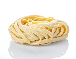Pasta nest of coiled, light yellow noodles sits atop reflective surface, against clean white