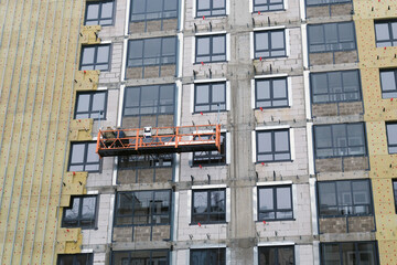 Obraz premium insulation of building facade using thermal insulation materials. modern construction technologies.