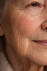 Obraz premium A close-up image capturing the right side of a mature woman's face, her skin revealing the intricate beauty and texture of aging.