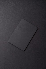 A black slate stone board or plate, an empty kitchen utensil. A black slate board