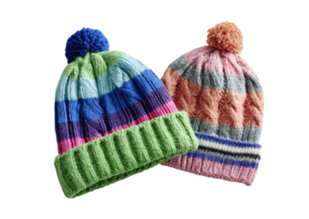 Knitted, striped hats with pom-poms, against black ground