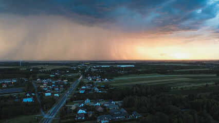 Evening sky filled with storm clouds over small town