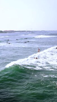 Woman Surfer Riding the Wave on a Sunny Day at the Beach