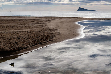 Tranquil Reflection on the Benidorm Shore