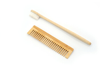Natural Wooden Toothbrush and Comb on White Background