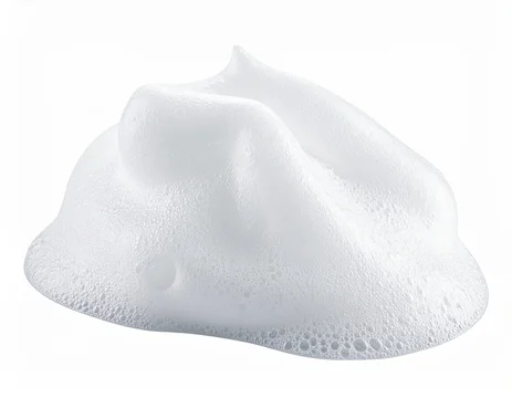 Fluffy, white foam clump on white background