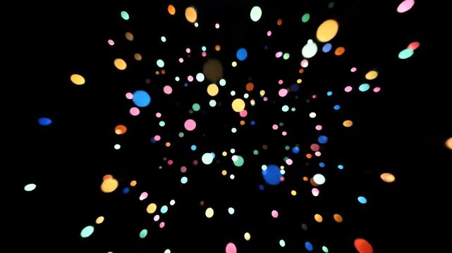 Colorful Confetti Falling Against Black Background.