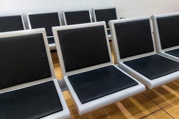 Black chairs lined up neatly in the room