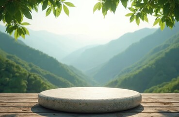 Round stone pedestal sits on wooden planks before misty mountain range backdrop. Rich green tree branches frame sunny scene. Natural outdoor display.