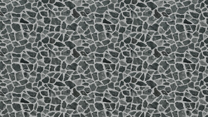 Abstract and seamless pattern of irregular natural grey and black stone fragments creating a rustic and textured background surface for design projects