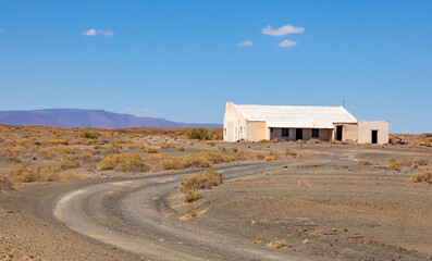 Old farm buildings in Karoo desert landscape © Sunshine Seeds