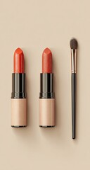 Obraz premium Two lipsticks & a brush, flat lay on a neutral background