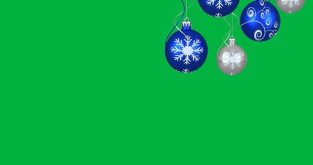 Animation of blue and silver baubles christmas decorations hanging on black background - Powered by Adobe