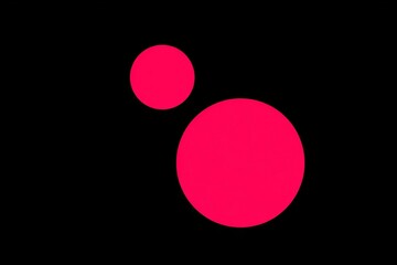 Bold pink circles on black background