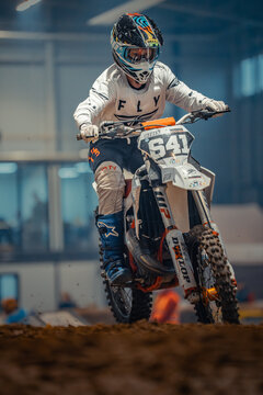 Latvia, Riga, 2025-08-27, regular training. Motocross rider in full gear navigating a dirt track on an off-road motorcycle with number 641