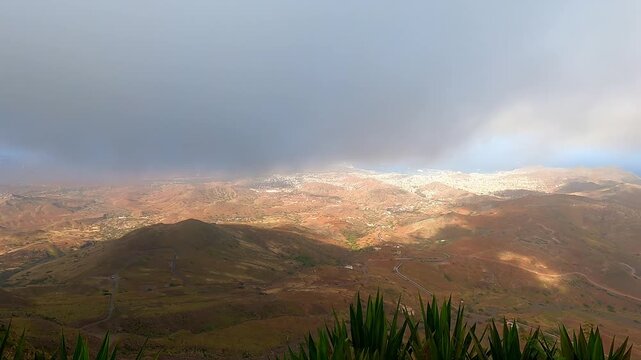 POV from the summit of Monte Verde on S&atilde;o Vicente Island, Cape Verde overlooking valley and coast under low cloud