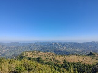 Scenic hill station landscape under a clear blue sky