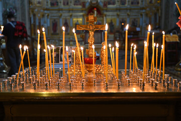 Close-up burning candles in the Orthodox church. Concept of religion and faith in god