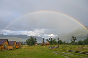 Full double rainbow over the forest