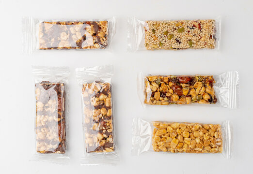Nut Bar in Plastic Package Isolated, Energy Snack with Nuts, Muesli, Protein Candy Bar, Fitness Fruit