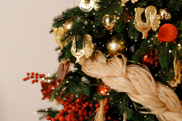 Elegant Christmas Tree Decorated with Red Berries and Ornaments
