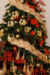 Elegant Christmas Tree Decorated with Red Berries and Ornaments