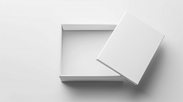 Vista cenital de caja de cart&oacute;n blanca vac&iacute;a con tapa