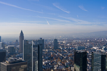 Fototapeta premium Aerial view from viewing platform of Main Tower platform with skyline and blue sky background on a sunny autumn day. Photo taken November 22nd, 2025, Frankfurt am Main, Germany.