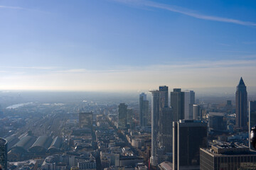 Fototapeta premium Aerial view from viewing platform of Main Tower platform with skyline and blue sky background on a sunny autumn day. Photo taken November 22nd, 2025, Frankfurt am Main, Germany.
